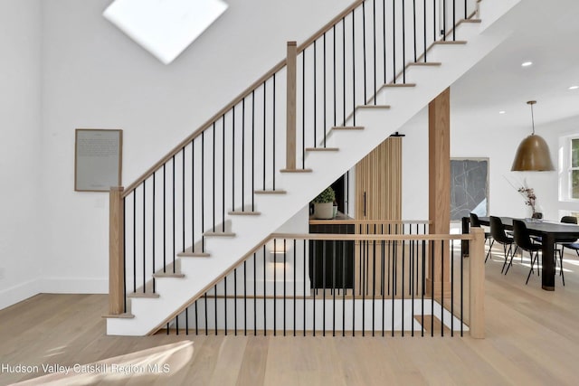 stairway featuring hardwood / wood-style floors