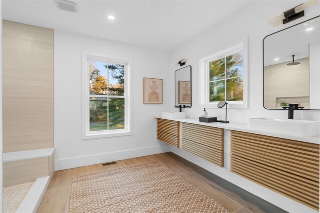 bathroom featuring vanity and hardwood / wood-style flooring