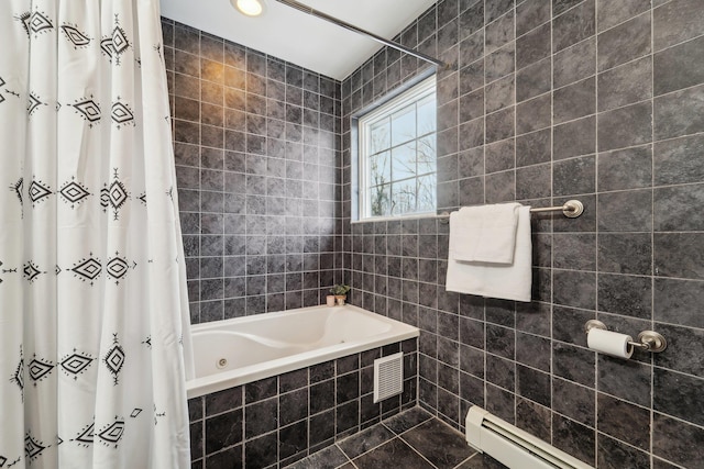 bathroom with tiled shower / bath combo and a baseboard heating unit