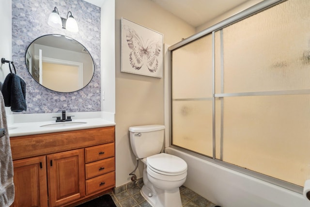 full bathroom featuring enclosed tub / shower combo, vanity, toilet, and tile patterned flooring