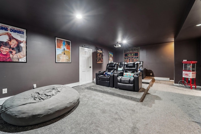 carpeted home theater with baseboard heating