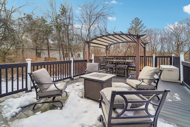 wooden deck featuring a pergola and a fire pit