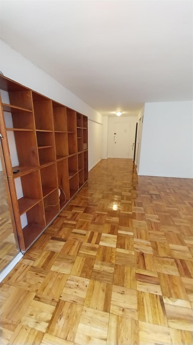 hallway featuring light parquet flooring