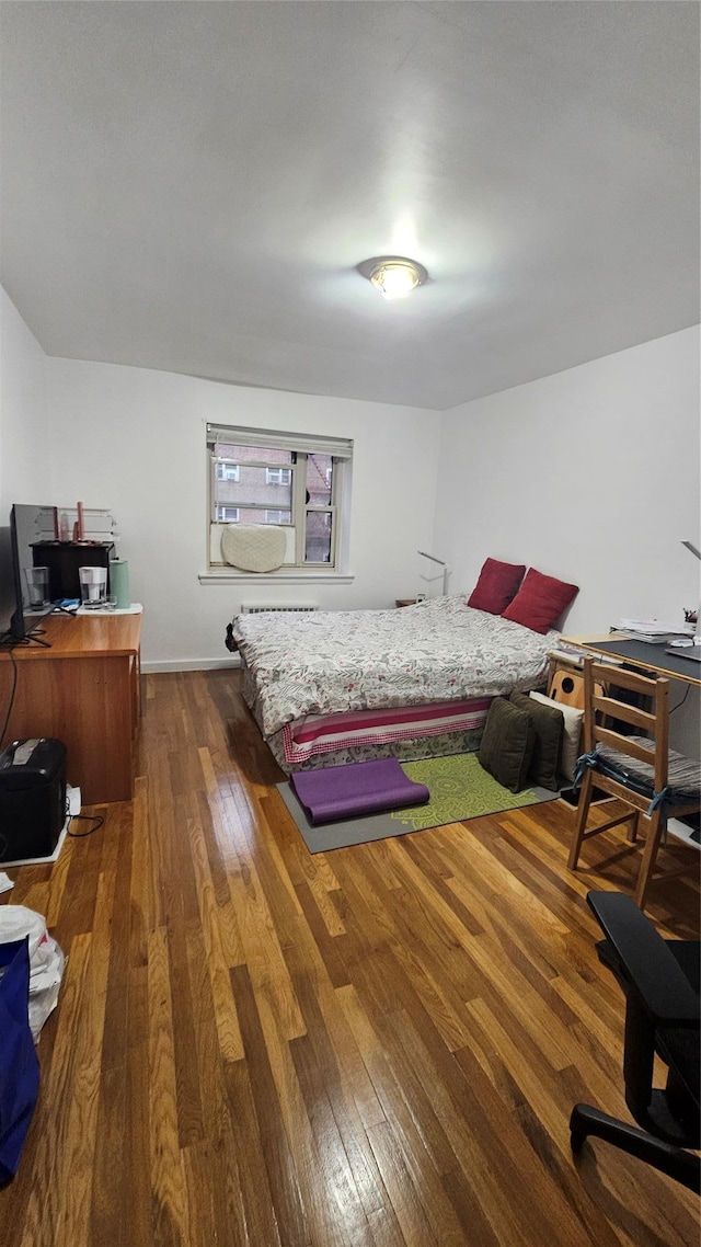 bedroom featuring dark hardwood / wood-style floors