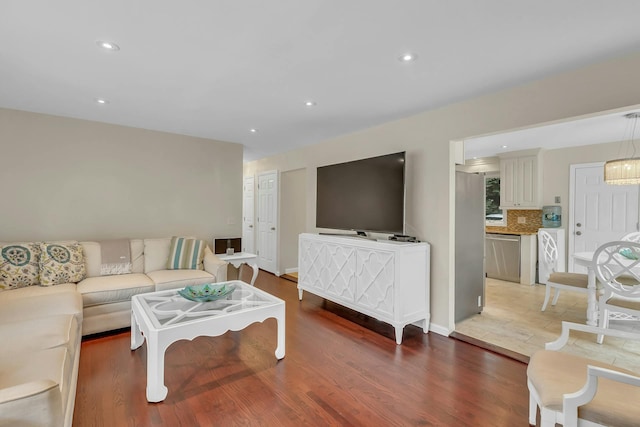 living room featuring hardwood / wood-style floors and washer / clothes dryer