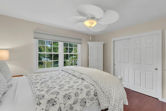 bedroom with ceiling fan and dark hardwood / wood-style flooring