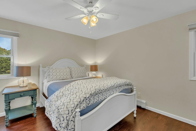 bedroom with dark hardwood / wood-style floors, a baseboard radiator, and ceiling fan