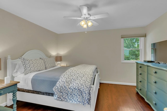 bedroom with ceiling fan and dark hardwood / wood-style flooring