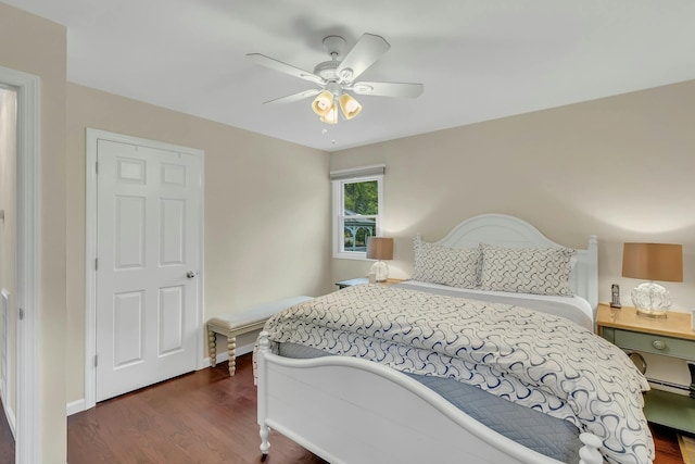 bedroom featuring ceiling fan and dark hardwood / wood-style floors