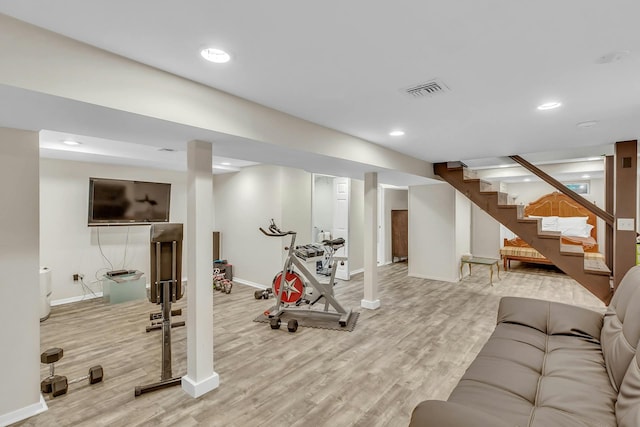 workout area featuring light wood-type flooring