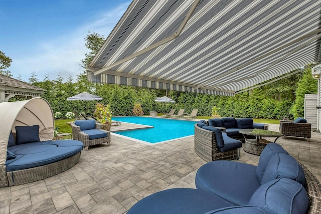 view of swimming pool with a patio area and an outdoor hangout area