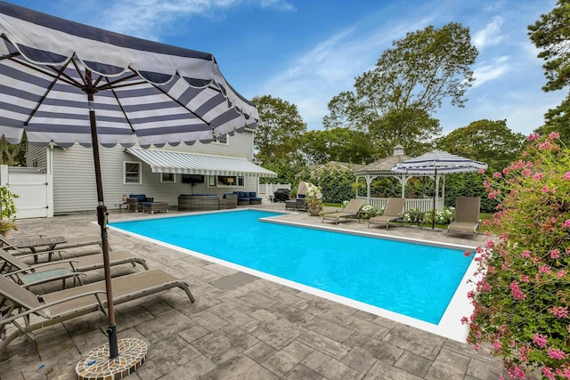 view of pool featuring a gazebo and a patio