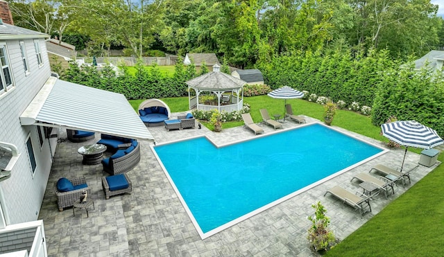 view of pool featuring a gazebo, a patio area, an outdoor hangout area, and a lawn