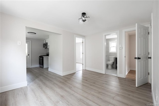 unfurnished room featuring light hardwood / wood-style flooring