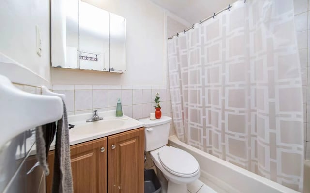 full bathroom with vanity, shower / bath combo, tile walls, and toilet