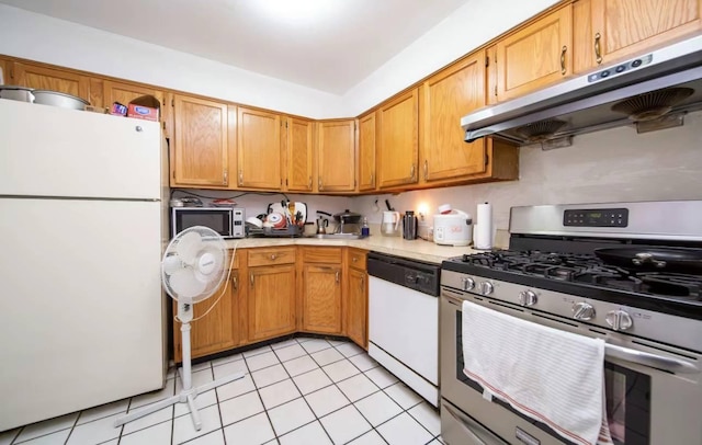 kitchen with light tile patterned floors and appliances with stainless steel finishes