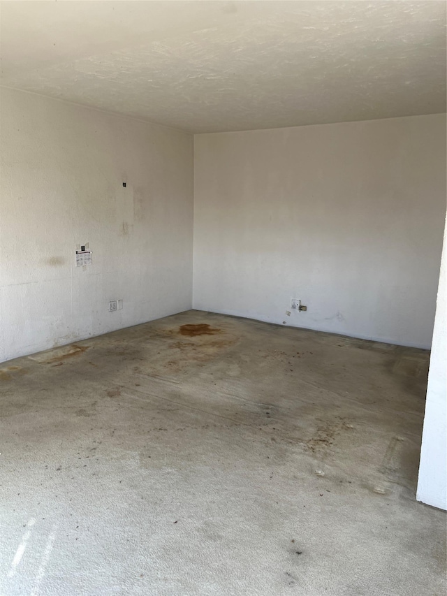 empty room with a textured ceiling