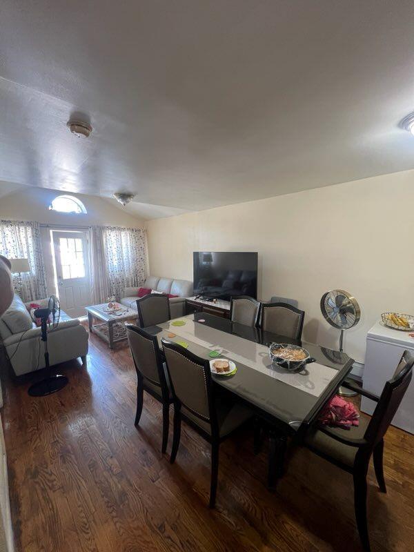 dining area with dark hardwood / wood-style flooring