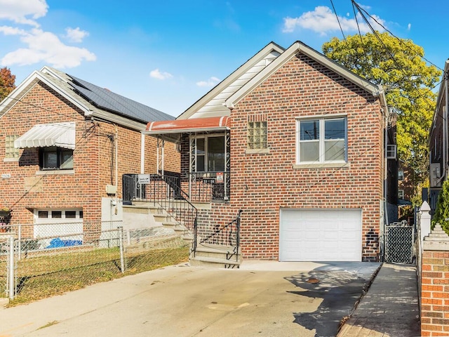 view of front of property featuring solar panels and a garage