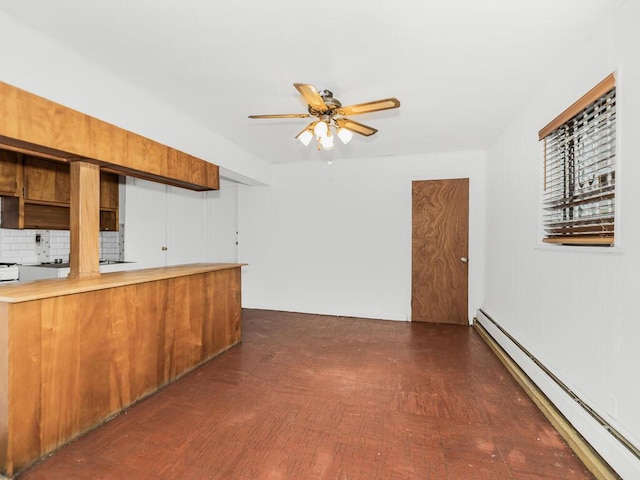 kitchen featuring dark hardwood / wood-style flooring, tasteful backsplash, ceiling fan, and a baseboard heating unit