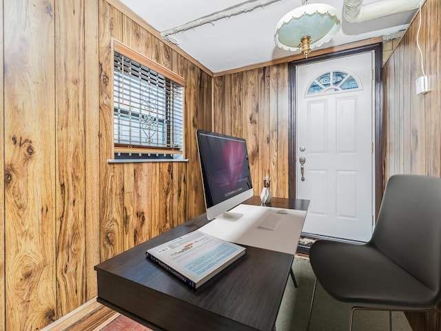 office area with wood walls