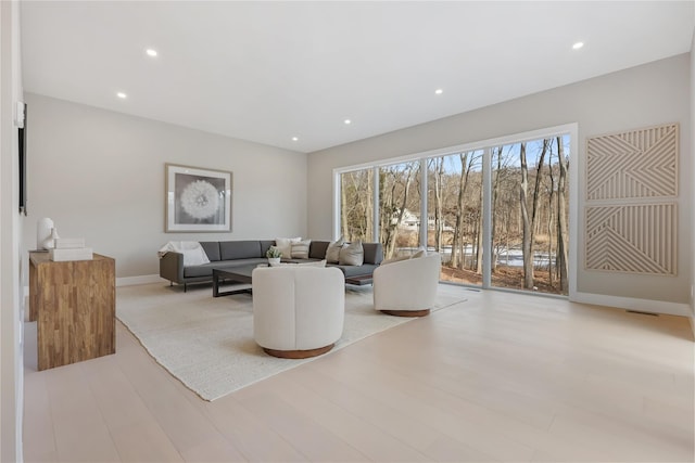 living room with light hardwood / wood-style floors