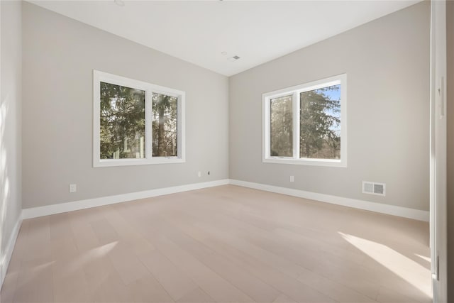 unfurnished room featuring light hardwood / wood-style flooring