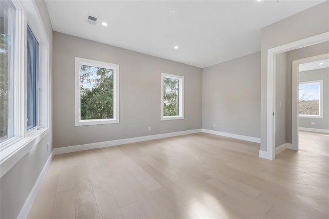 spare room featuring light hardwood / wood-style flooring