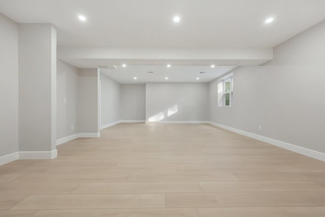 basement featuring light hardwood / wood-style floors