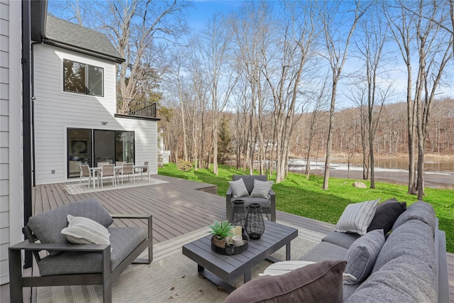 wooden deck featuring a yard and an outdoor living space