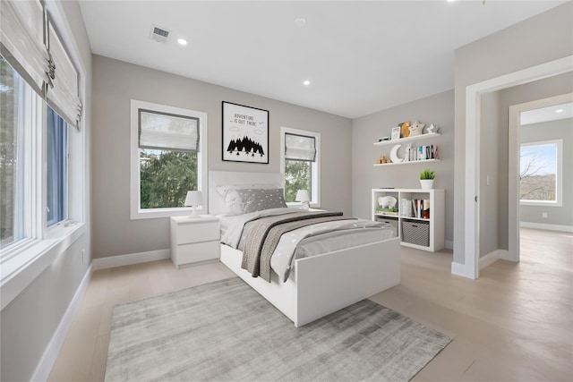 bedroom with light hardwood / wood-style floors