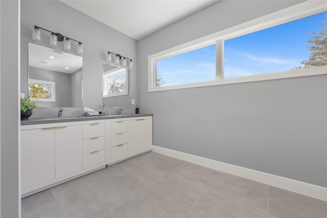 88 Byram Ridge Rd, Armonk, NY 10504 - bathroom featuring a sink, double vanity, and a healthy amount of sunlight