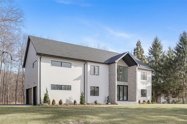 88 Byram Ridge Rd, Armonk, NY 10504 - view of front of house with an attached garage, a front lawn, and roof with shingles