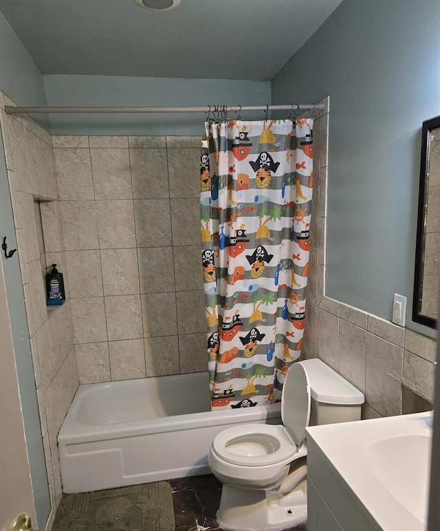 full bathroom with vanity, shower / bath combo, tile walls, and toilet