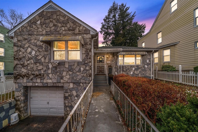 view of front of property with a garage