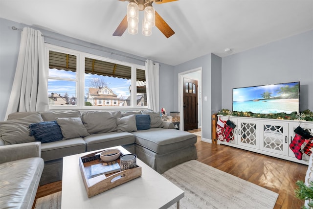 living room with hardwood / wood-style flooring and ceiling fan