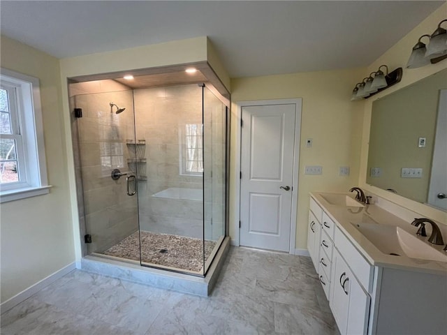 bathroom featuring vanity and an enclosed shower