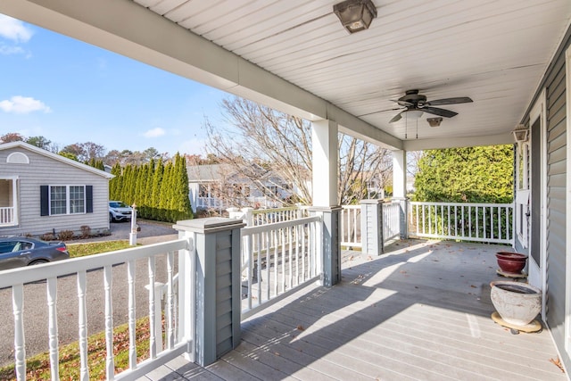 wooden deck featuring ceiling fan and a porch