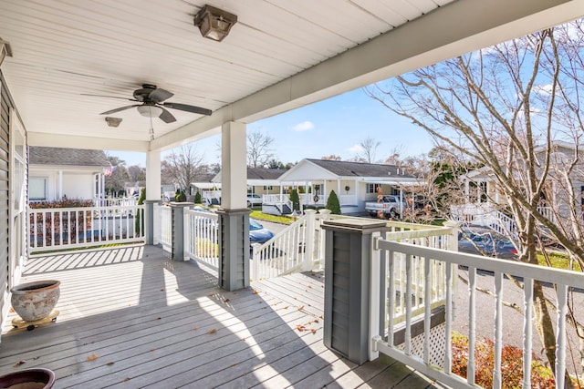 wooden terrace featuring ceiling fan and a porch