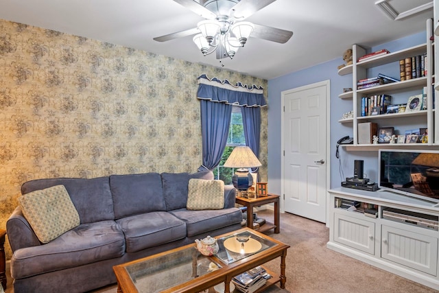 carpeted living room featuring ceiling fan