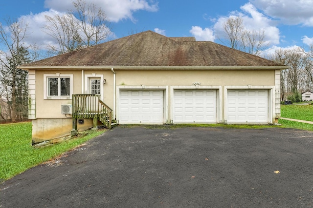 ranch-style house featuring a garage