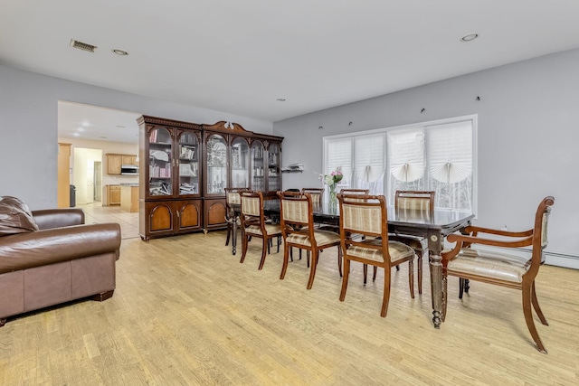 dining room with light hardwood / wood-style floors