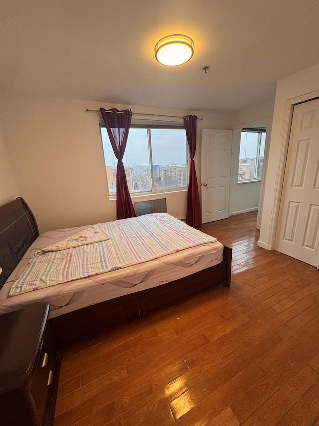 bedroom featuring wood-type flooring