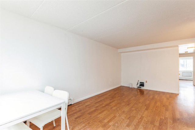 clothes washing area featuring light hardwood / wood-style flooring