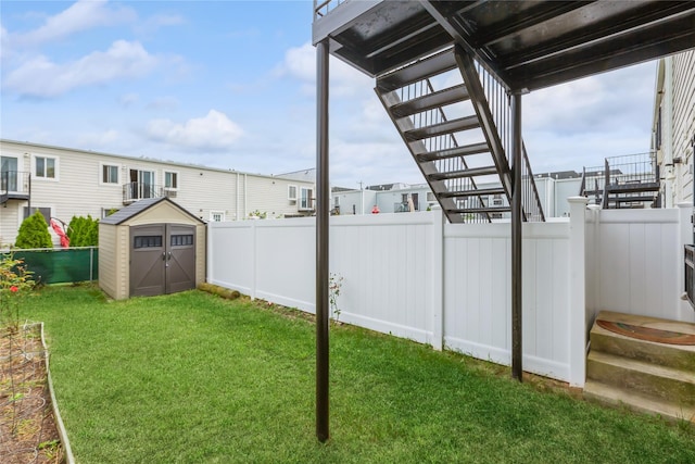 view of yard with a storage unit