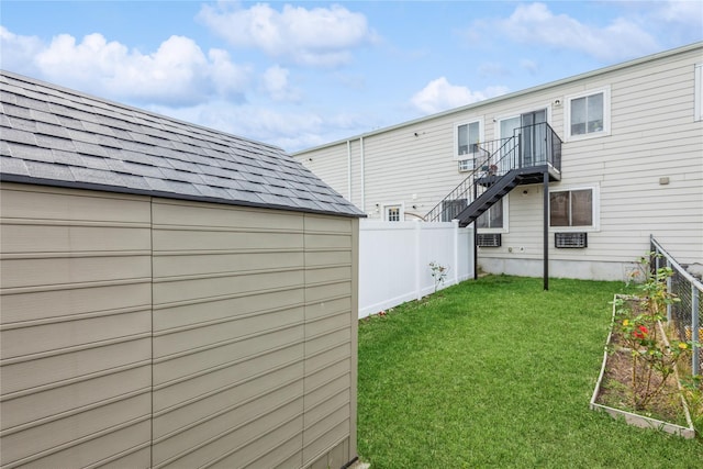 view of yard with cooling unit and an outdoor structure