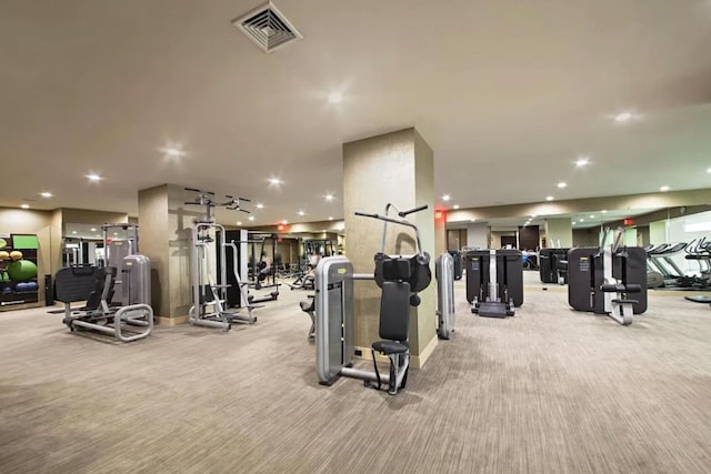 workout area featuring light carpet