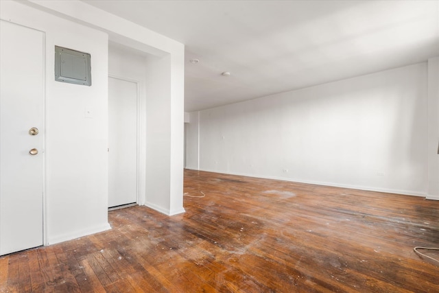 unfurnished room featuring dark hardwood / wood-style floors