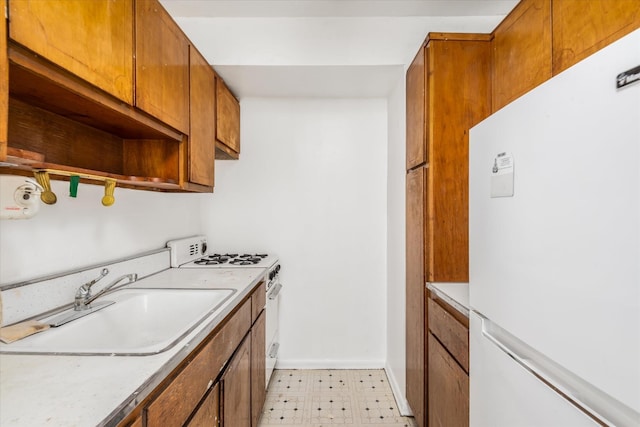 kitchen with white appliances and sink