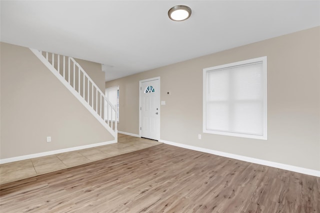 foyer with light hardwood / wood-style floors